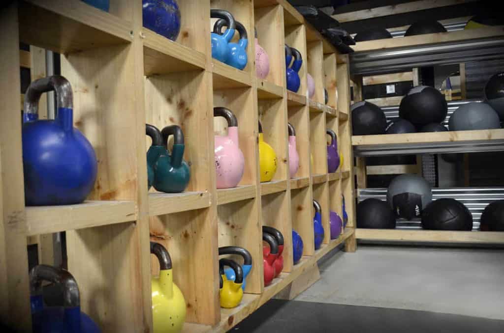 Shelf with colourful Kettlebells and Wall Balls at Bandon Strength and Conditioning